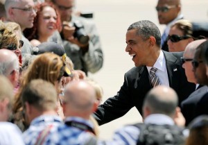 President Barack Obama shakes hands with supporters after his arrival at Peterson Air Force Base in Colorado Springs, Colo., Thursday, Aug. 9, 2012. (AP | Chris Schneider)