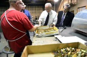 U.S. Rep. Mike Coffman, center, speaks with Andrew Shields as he makes spinner back-plate brackets during a visit to Univair Aircraft Corporation's headquarters in Aurora. Coffman is running for re-election in the 6th Congressional District. (Photos by AAron Ontiveroz, The Denver Post)