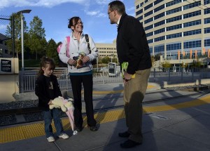 State Rep. Joe Miklosi greets Richelle Hentemann and her daughter, Madison, 4, at a light-rail station near I-25 and Orchard Road in Greenwood Village. "He's a very diligent, earnest and driven individual," said former House Speaker Andrew Romanoff. (Andy Cross, The Denver Post)